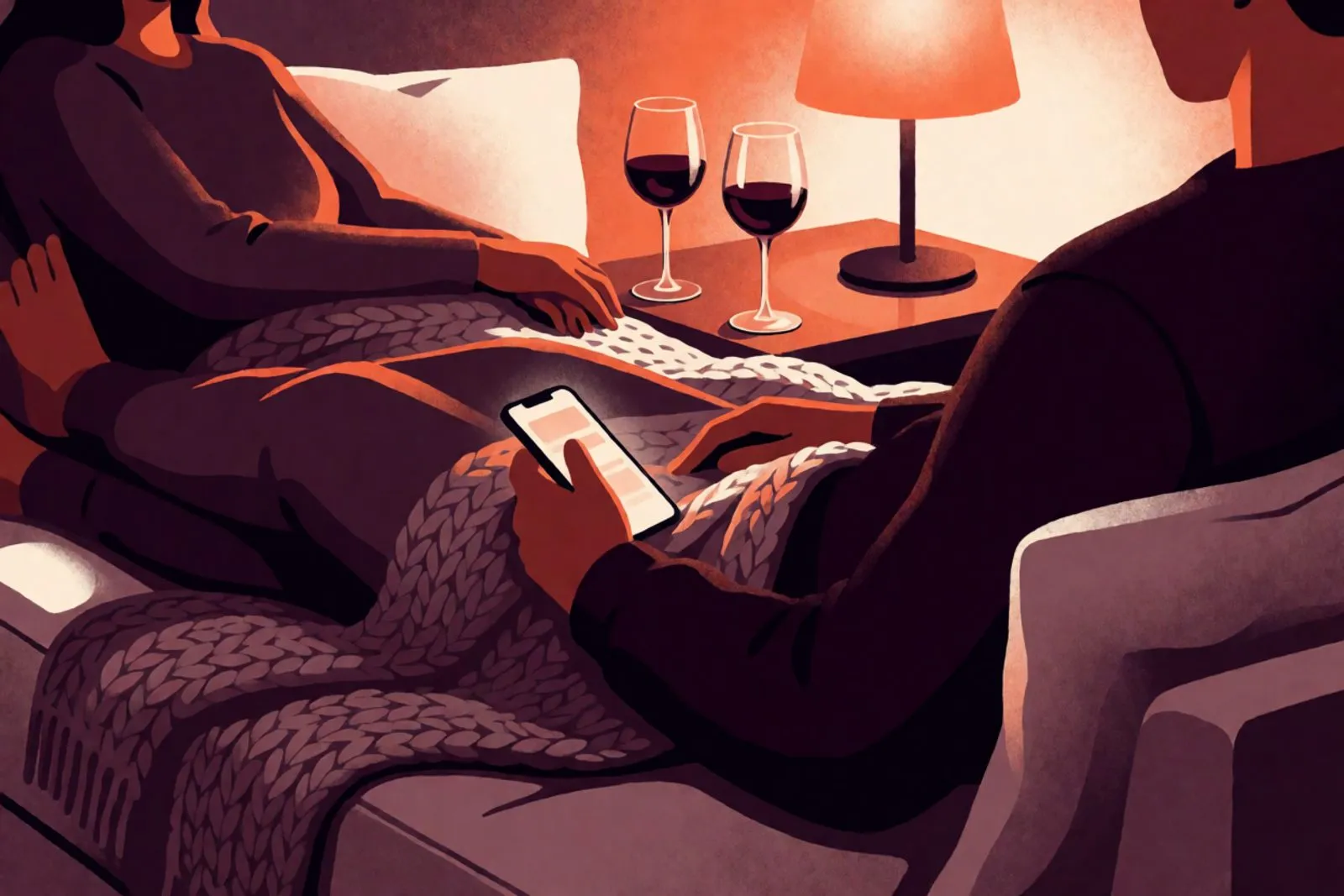 Two people on a couch late at night, faces out of frame, a phone glowing between them and a half-finished glass of wine.